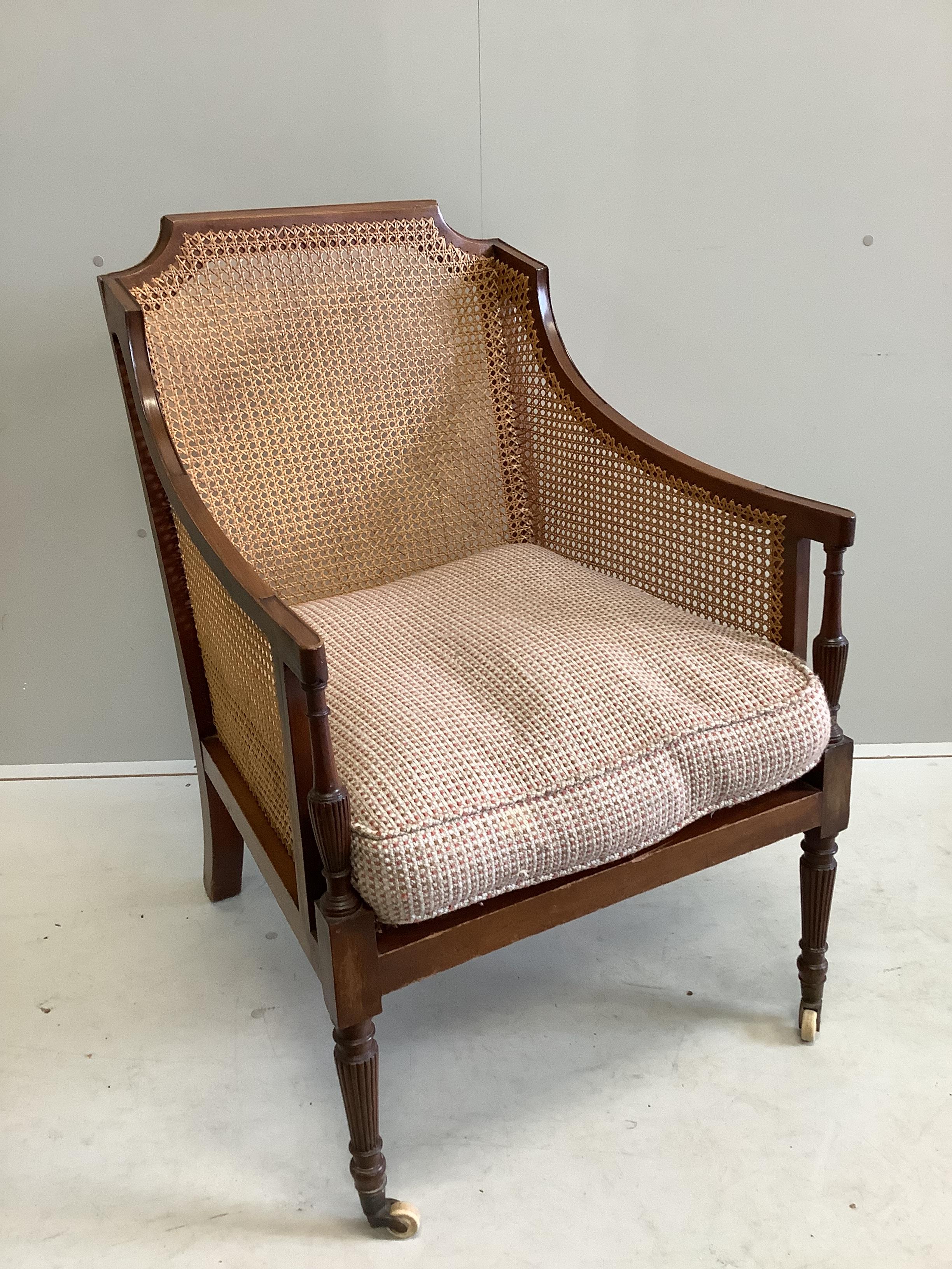 A Regency style mahogany Bergere armchair, width 65cm, depth 72cm, height 96cm